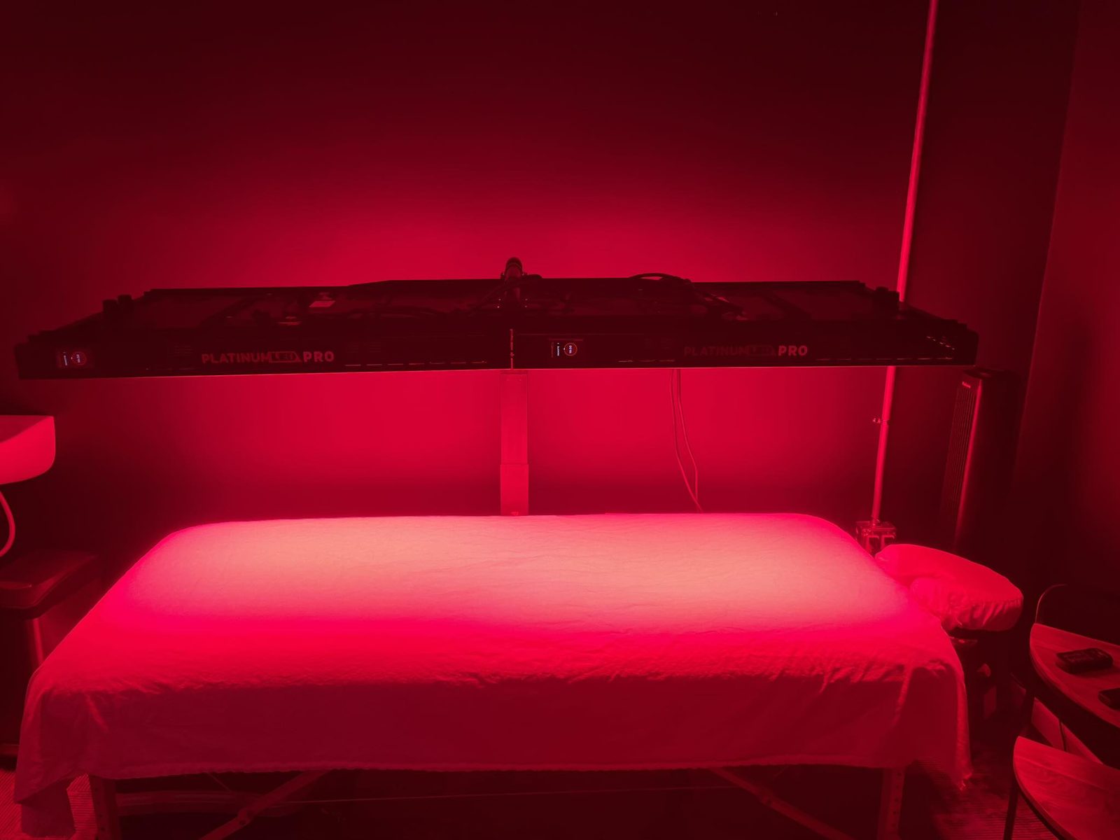 Red light therapy bed glowing red